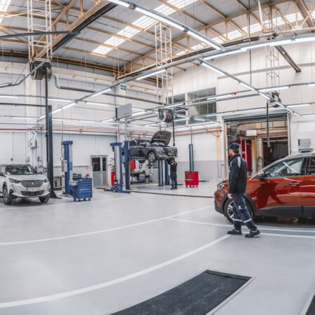 A car is parked inside of a garage